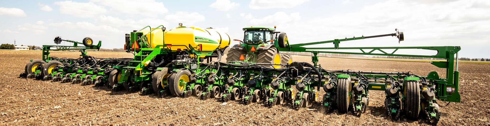 Tractor pulling a planting attachment